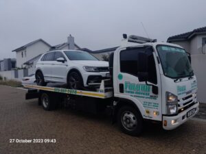 folami flatbed truck moving a vw
