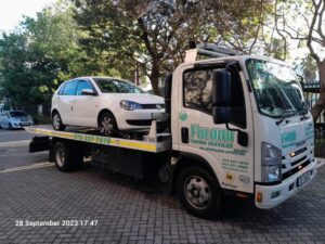 vw polo being moved by a tow truck