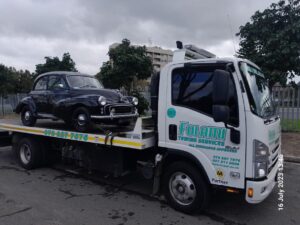 folami truck flatbed moving black vintage car