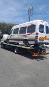 folami towing truck moving a van
