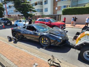 folami towing truck moving a ferrari