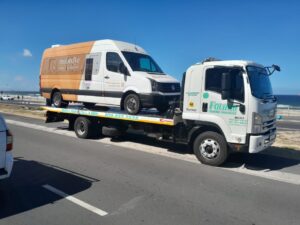 folami towing truck moving a van