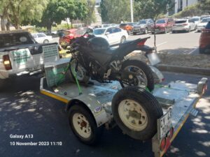 folami towing trailer with a motorbike